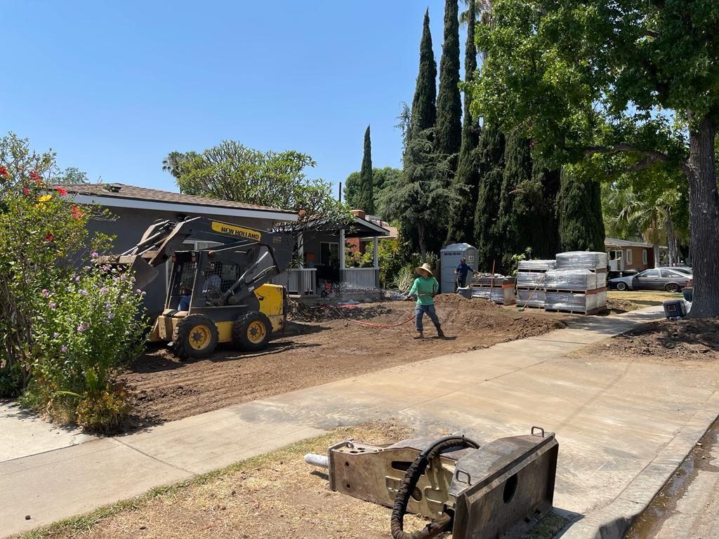 Before: Front yard being excavated for a new driveway