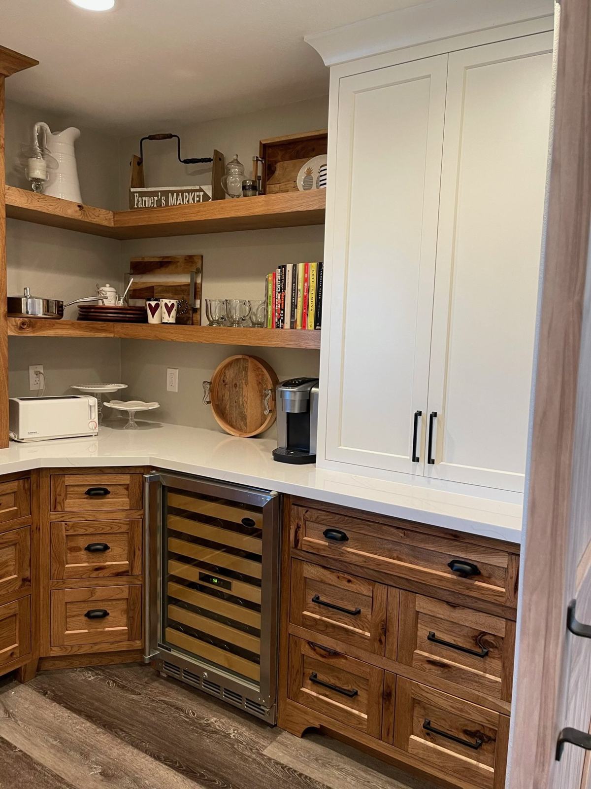 Butler pantry with hickory cabinets and wine fridge