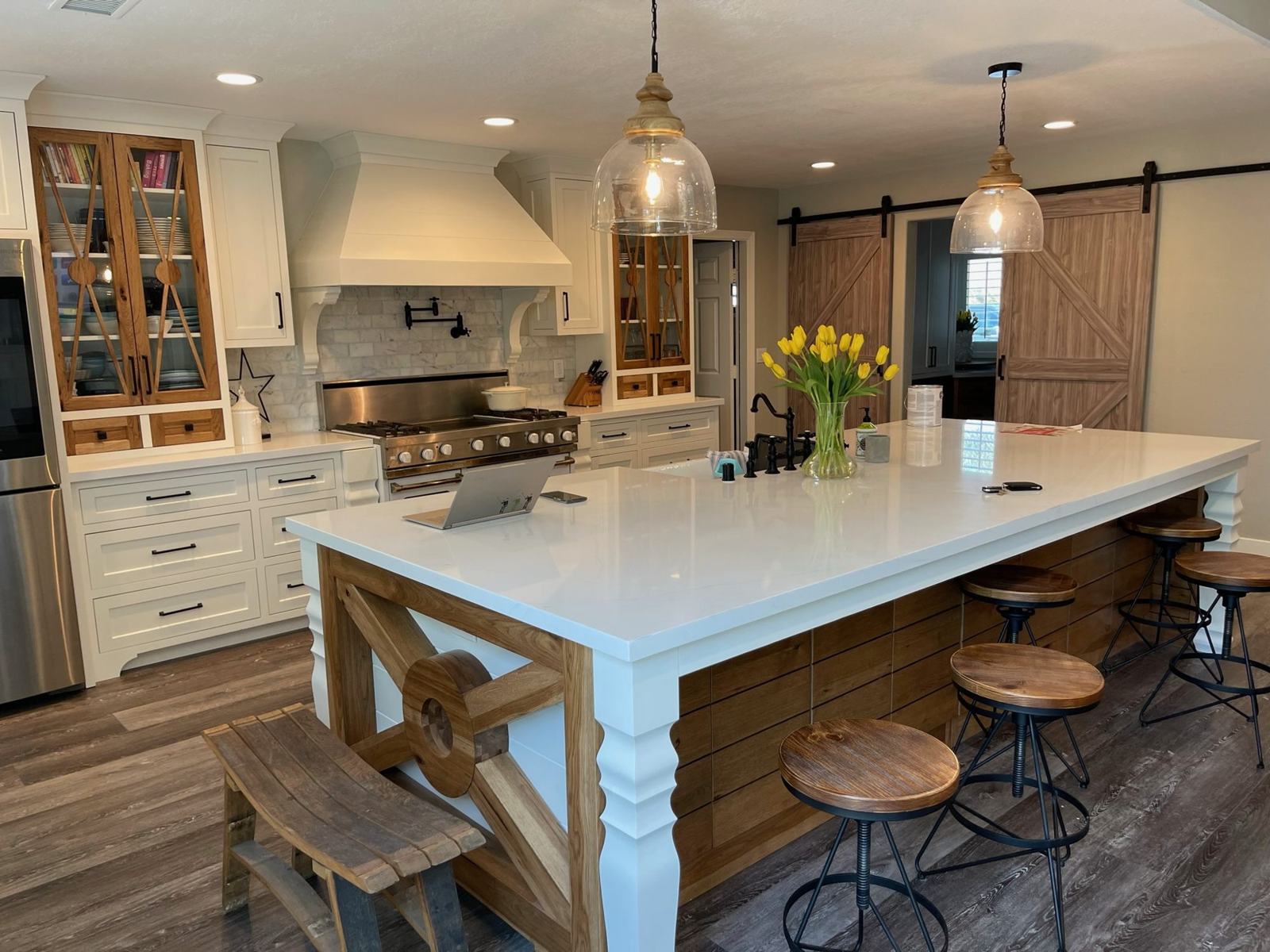 Remodeled farmhouse kitchen with quartz island