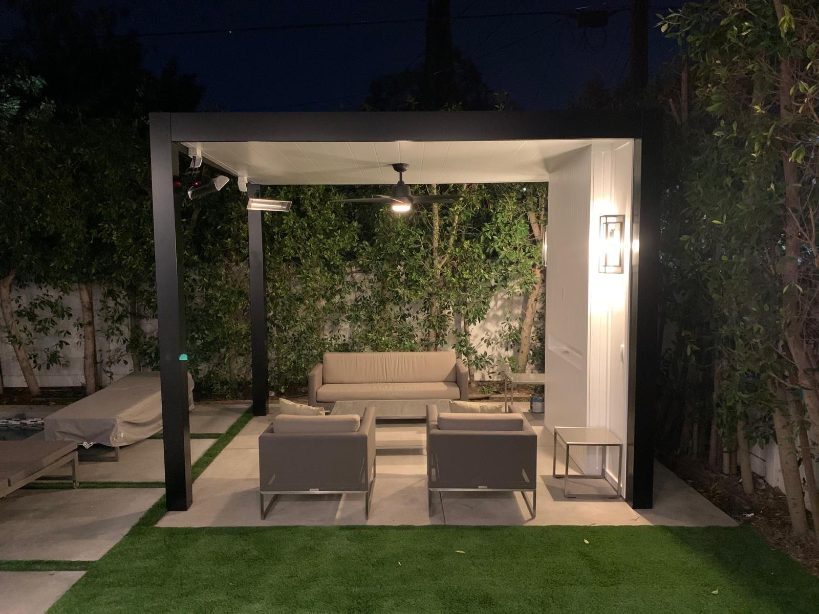 Modern patio cover lit at night