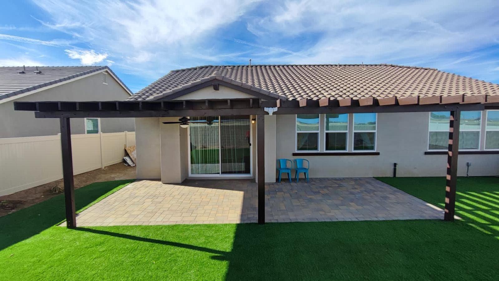 Wood patio cover over pavers and turf