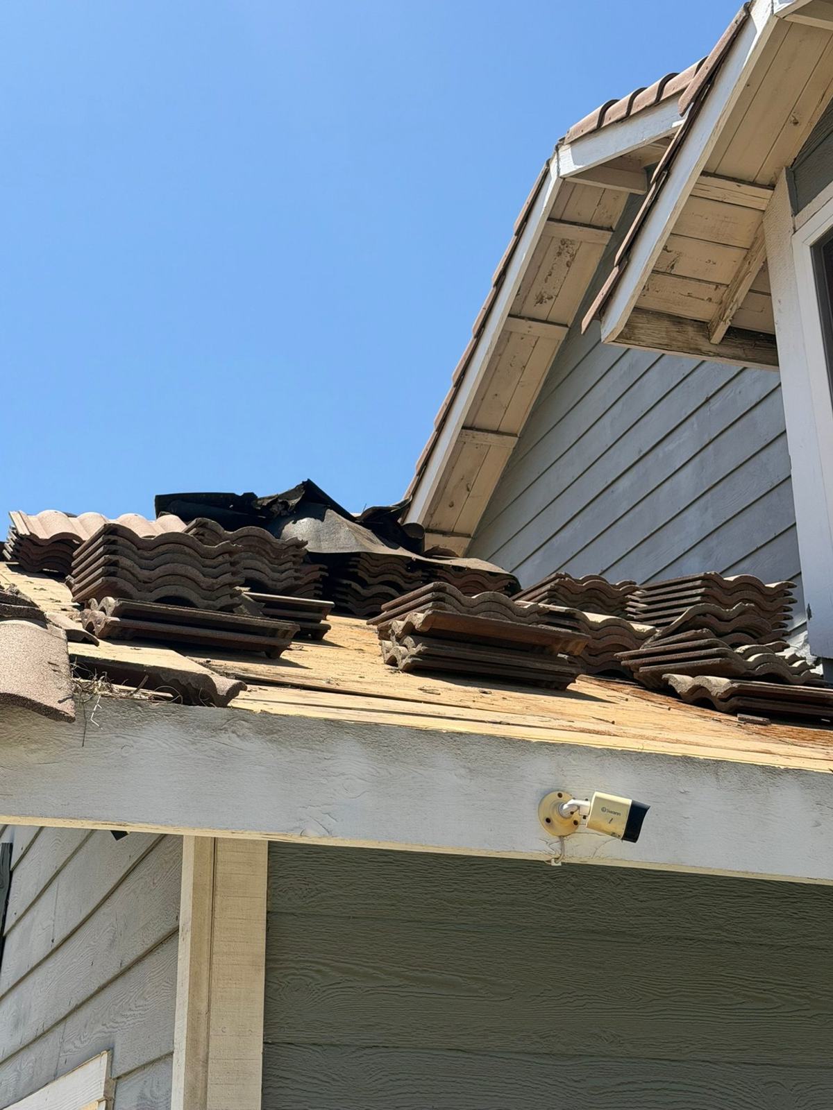 Roof tiles staged during a re-lay